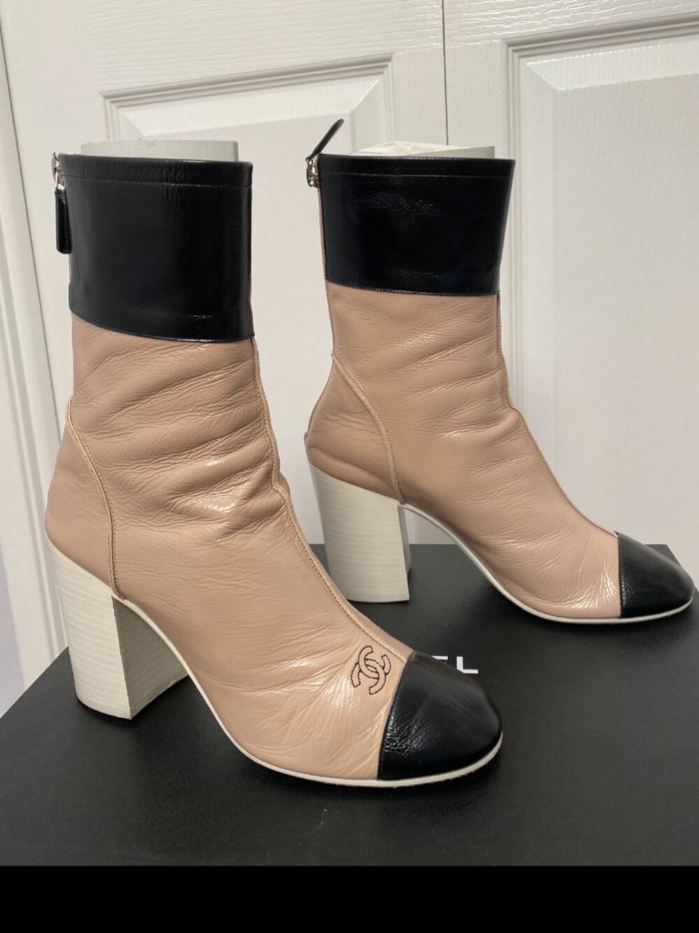 CHANEL Two-Toned Leather Cap-Toe Block Heel Ankle Boots in Beige & Black
